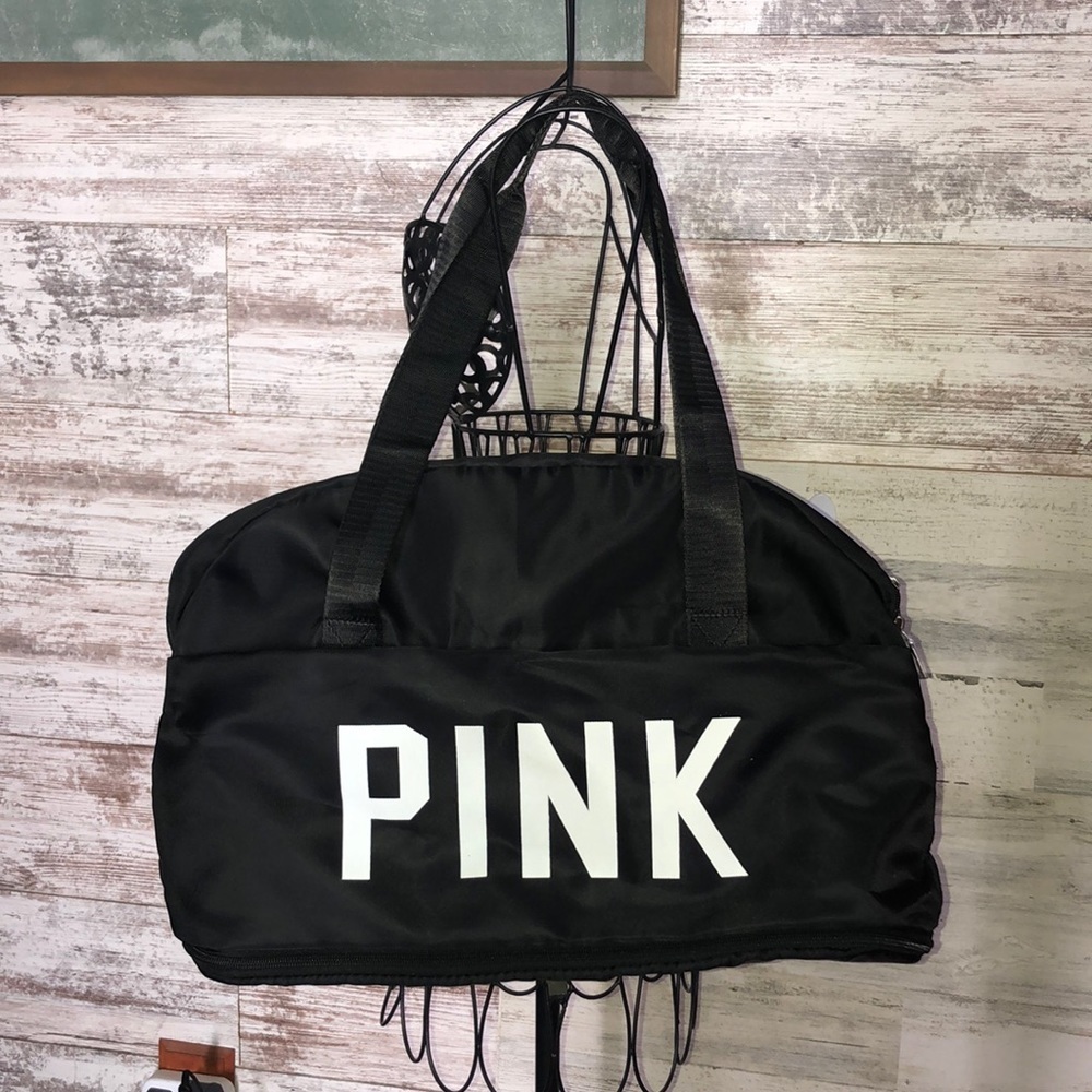 Pink Victoria’s Secret travel bag black and white extends out medium size NWOT​​